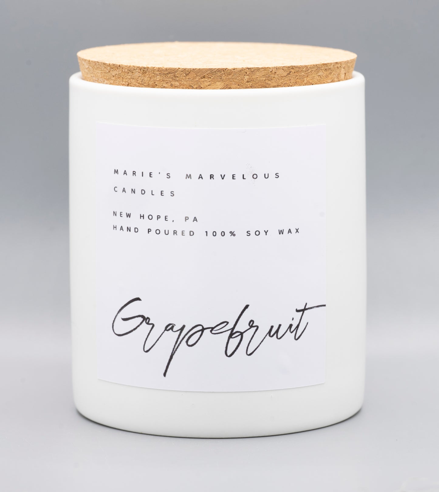 15 ounce Grapefruit fragrance in a white ceramic jar with fitted cork lid
