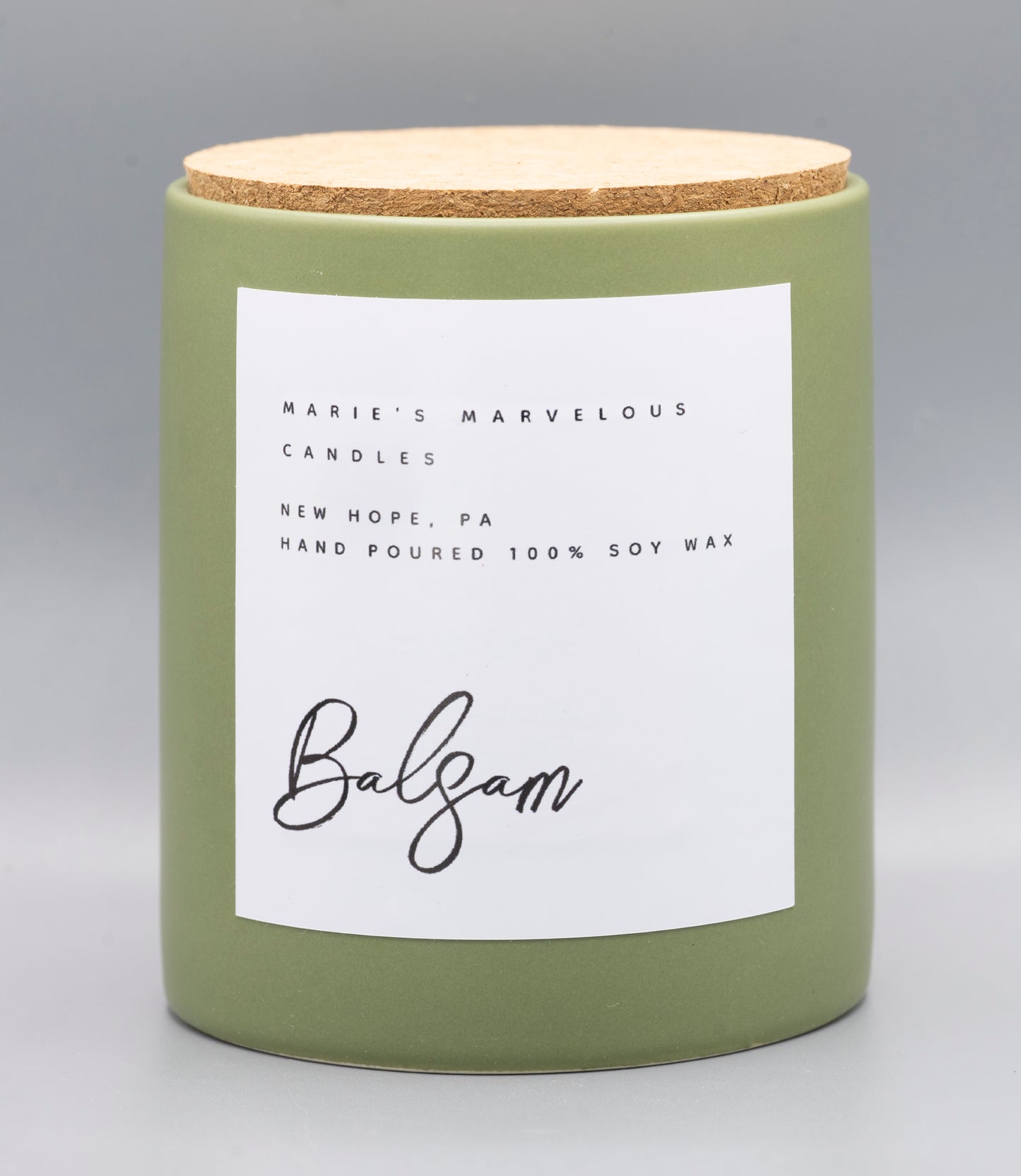 15 ounce Balsam Evergreen fragrance in a sage green stone ceramic jar with fitted cork lid