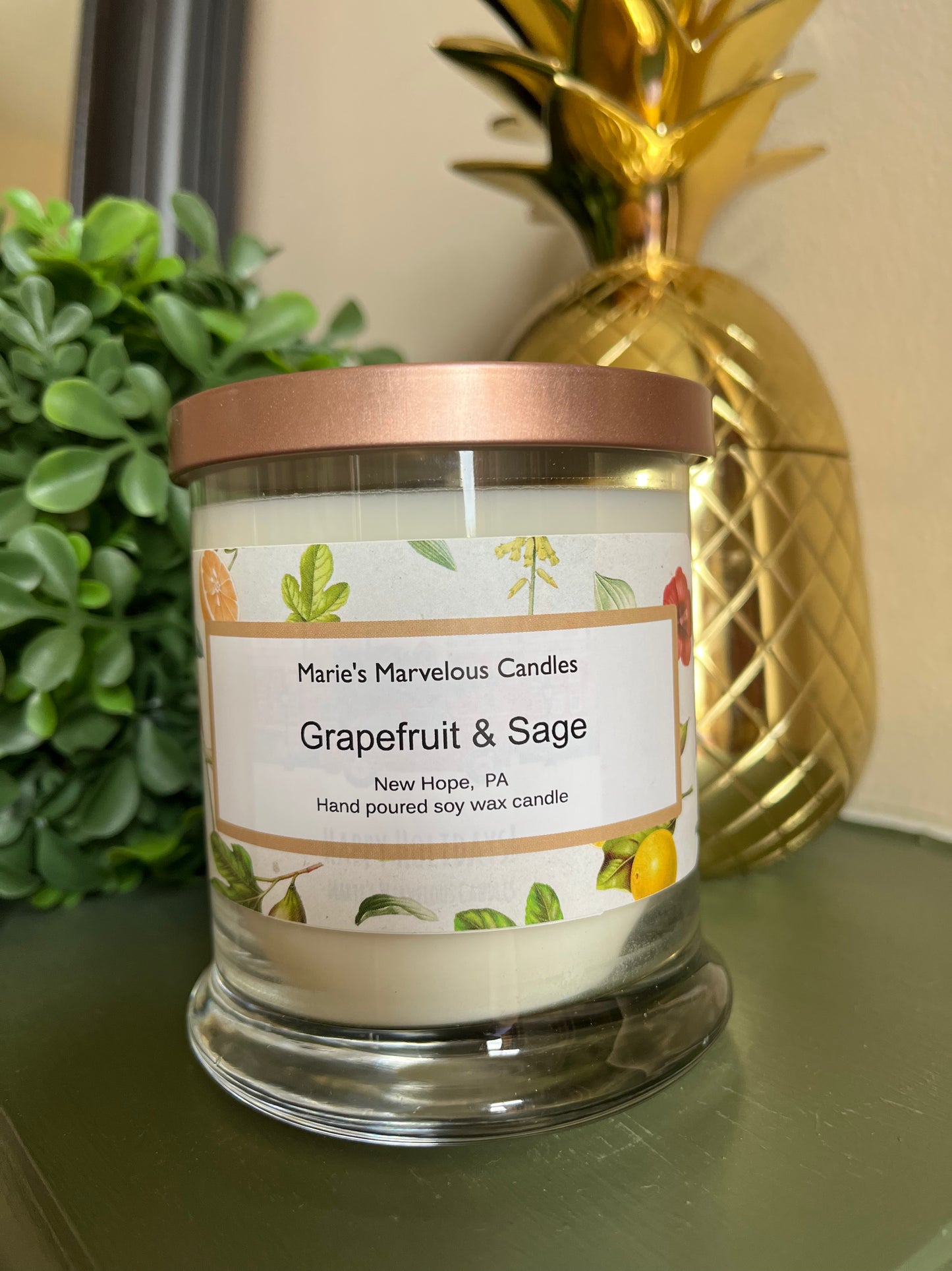 12.5 ounce Grapefruit and Sage fragrance in a status glass jar with rose gold tin lid