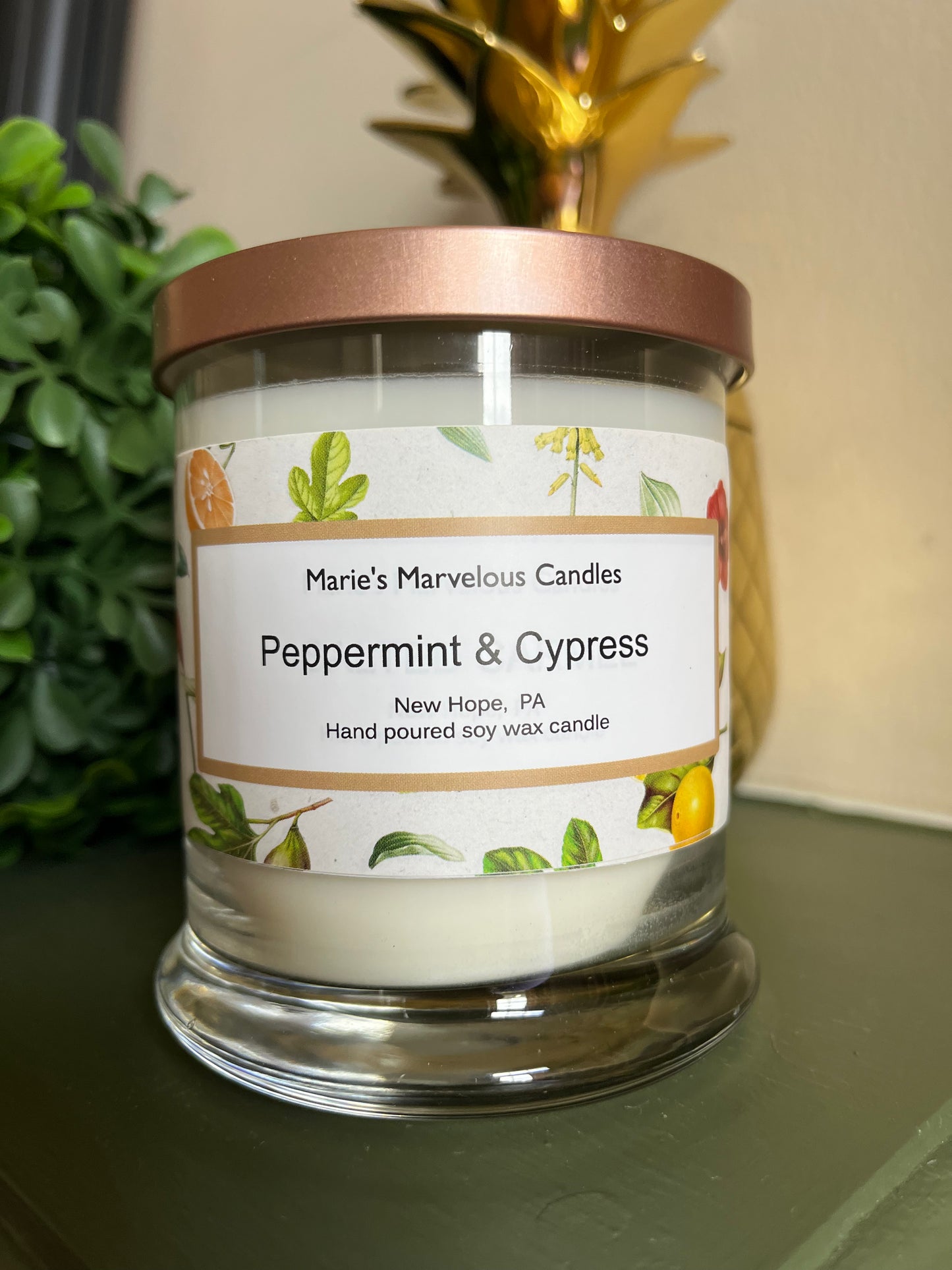 12.5 ounce Peppermint and Cypress fragrance in a status glass jar with rose gold tin lid