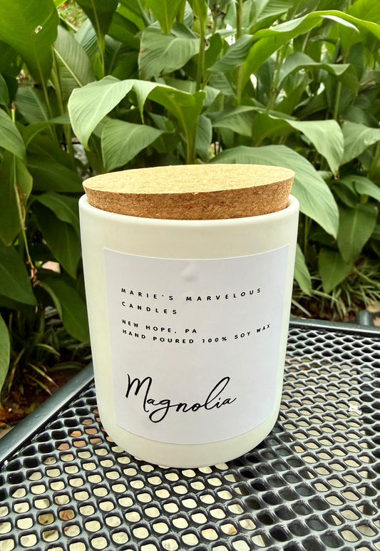 15 ounce Magnolia fragrance in a white ceramic jar with fitted cork lid